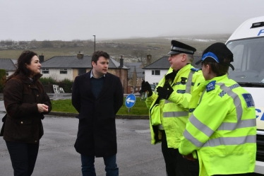 Pictured is Robert with Sgt. Lee Baker (right) and Angelique Foster (left) in Harpur Hill, Buxton. 